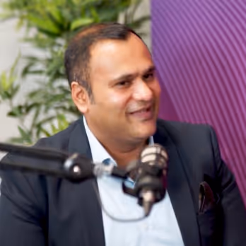 Governa Connect podcast guest speaking into a microphone.